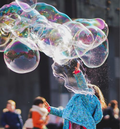 NoBo Kiddo girl-playing-with-bubbles